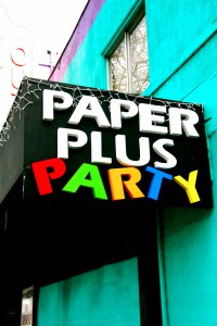 paper plus sign on store exterior