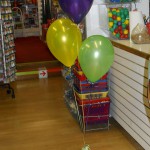 purple balloon, yellow balloon, green balloon