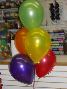 Red, orange, yellow, green, and purple balloons