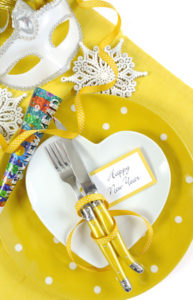 Yellow and white Happy New Year table place setting.