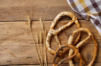 pretzels and oktoberfest cloth on wooden table