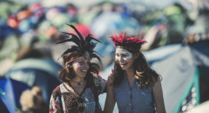 women dressed in feather costumes
