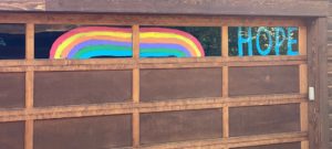 rainbow and hope painted on windows