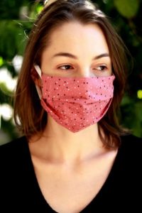 woman wearing pink mask