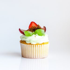 vanilla cupcake with vanilla frosting and fruit