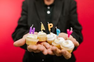 candles spelling happy on cupcakes for anniversary