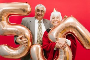 couple celebrating 55th annivesary with balloons