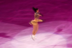 figure skater in olympics spinning jump