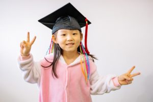 kindergartener with graduation cap