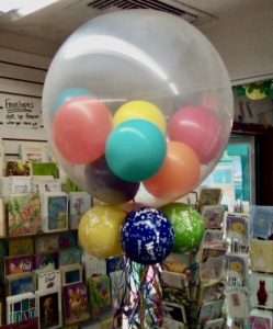 big clear balloon filled with small balloons