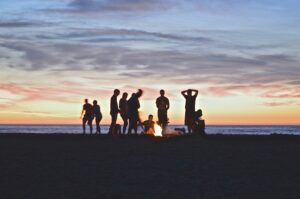 people have a party and fire at a beach party